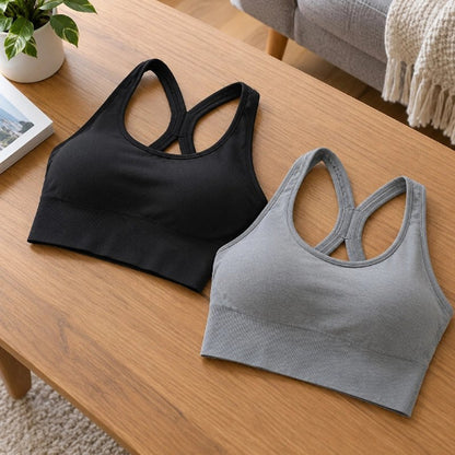 Soutien gorge sport choix de deux couleurs sur table yoga zenitude